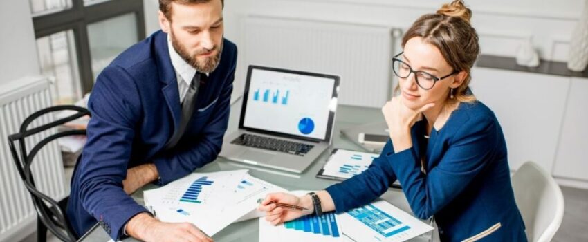 Adoption Process in Marketing Two business people discuss the five stages of adoption process in marketing.