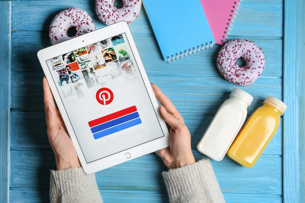 how to get more followers on pinterest Someone logging into their Pinterest account.