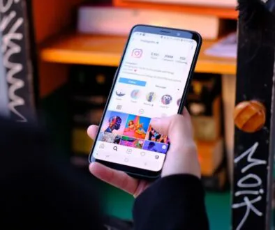 The woman is scrolling through her Instagram.