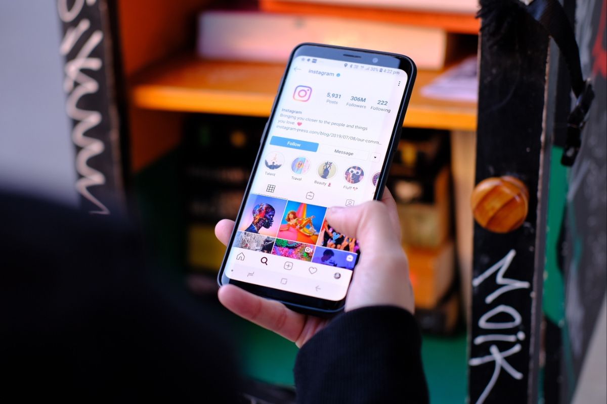 The woman is scrolling through her Instagram.