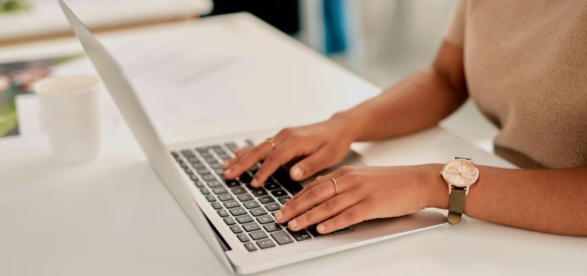 The woman is trying to engage potential customers using social media.