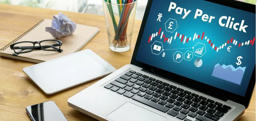 pay per click facebook (1) The laptop displays a graphic about Facebook pay-per-click (PPC) campaigns.
