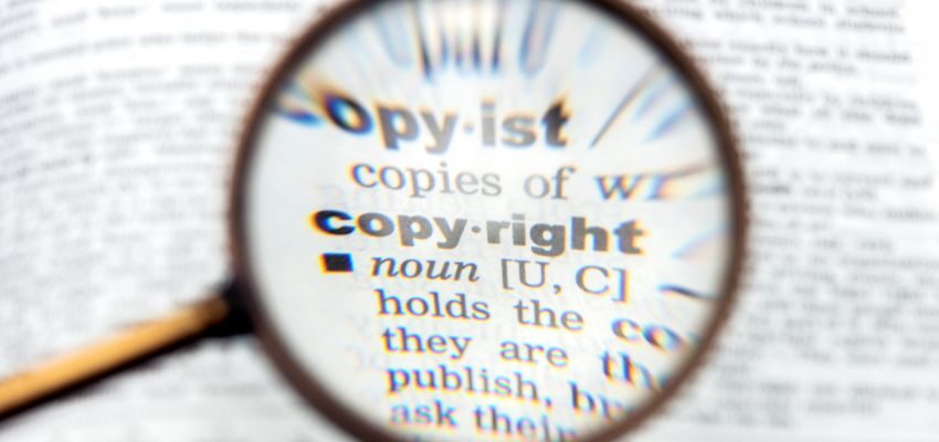 image is copyrighted (3) The magnifying glass focuses on the meaning of copyright.