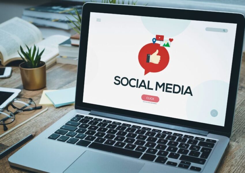 socialmedia-optimization (2) A laptop has a social media background.