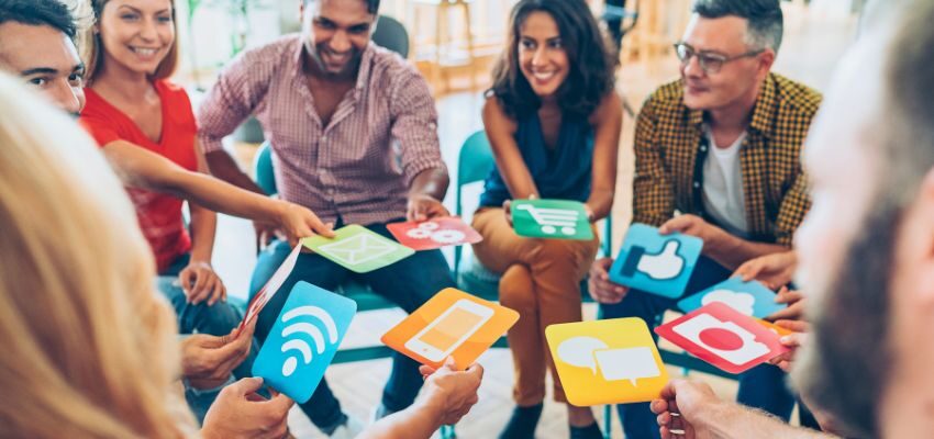 socialmedia-optimization (4) A team of employees uses social media optimization to boost online visibility.