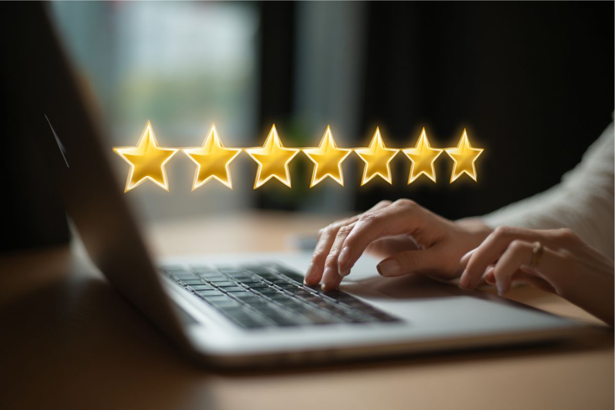 The woman is reading an online review.